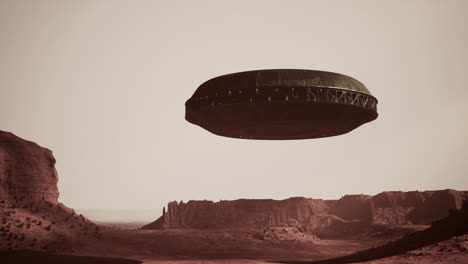 ufo hovering over a red desert landscape