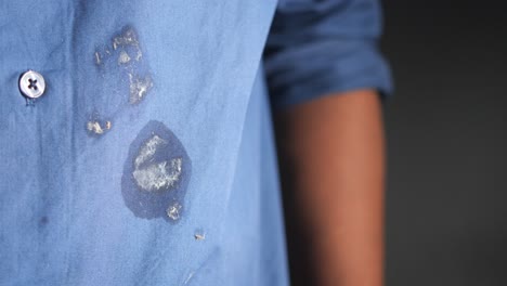 a close-up of a stained blue shirt