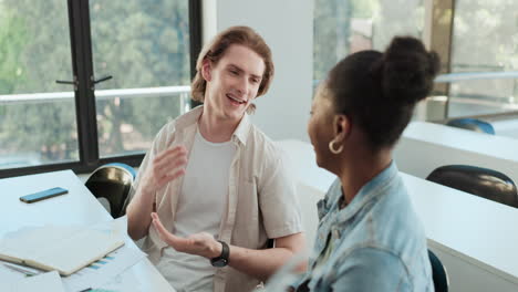 two students engaging in a classroom conversation