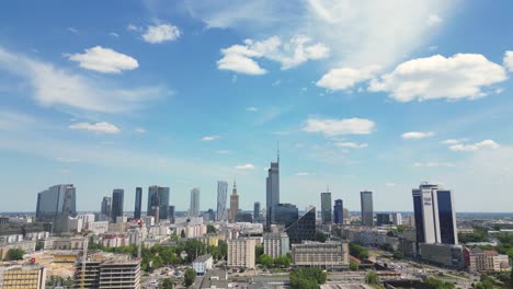 Aerial-panorama-of-Warsaw,-Poland-over-the-Vistual-river-and-City-center-in-a-distance