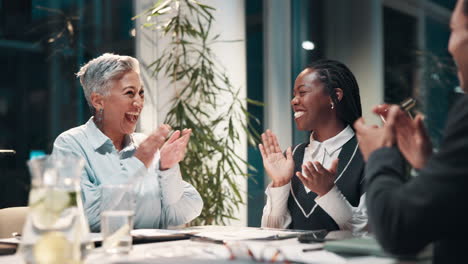 diverse team celebrates success in business meeting