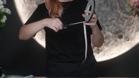 florist working with tape and flowers