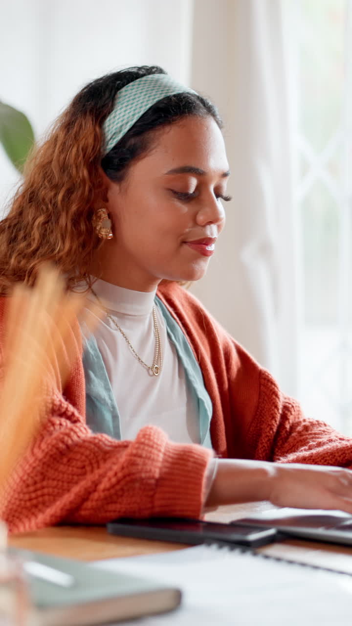 Young Woman Working and Typing on Laptop at Home Office Desk