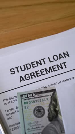student loan concept. vertical shot of loan agreement documents.