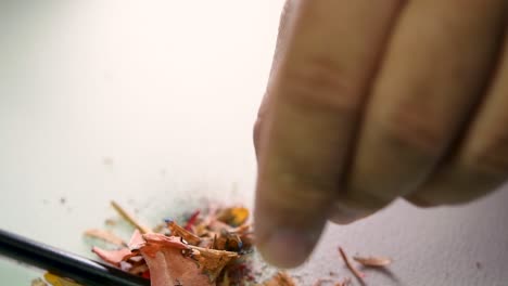 Footage-of-hands-slowly-sharpening-a-pencil-and-some-coloured-pencils-with-a-Wedge-Pencil-Sharpener