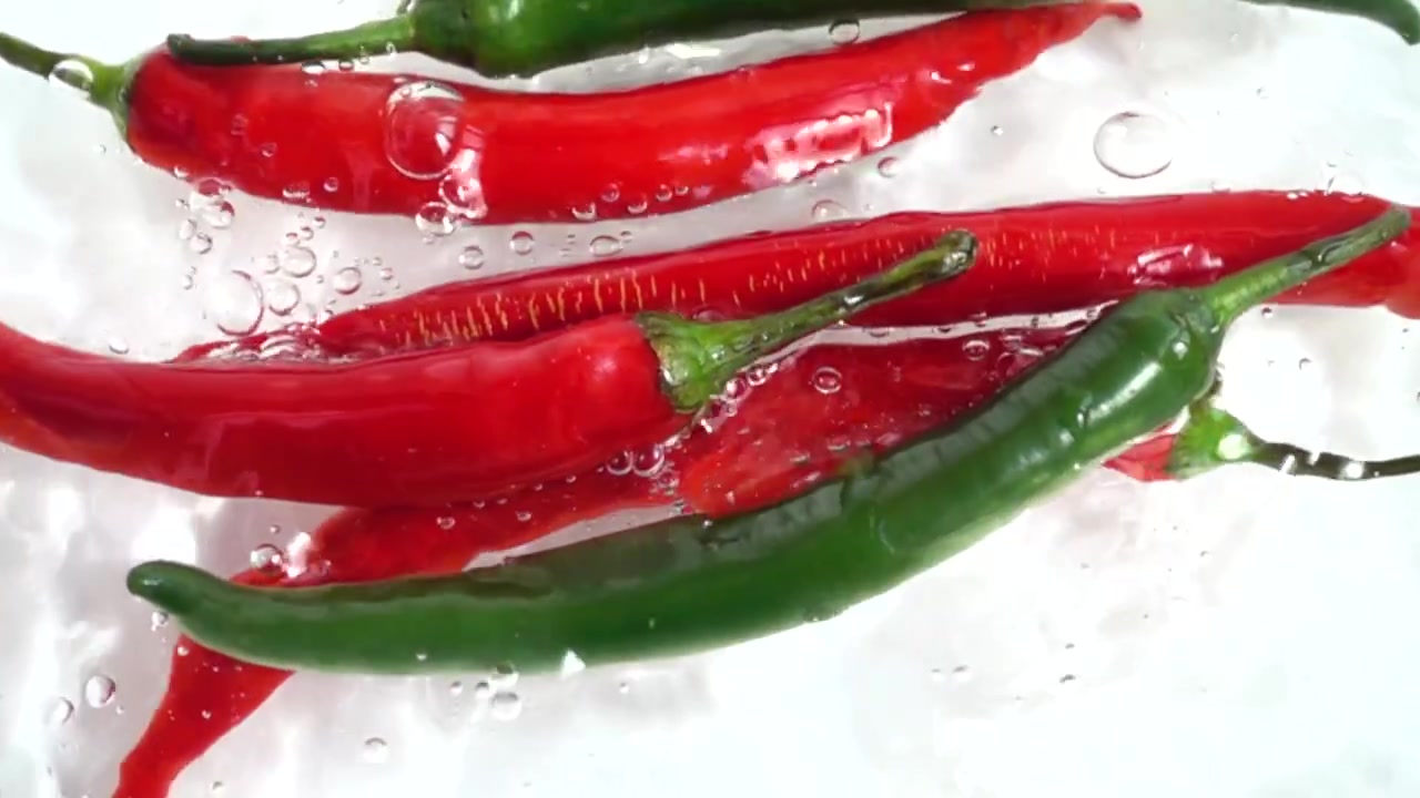 Fresh chili pepper. Slow motion.