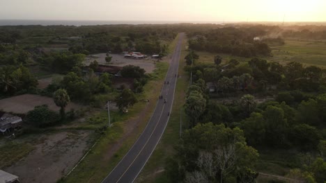 aerial view, sunset with big road between savanna and sea coast