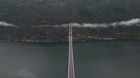 areal footage of a suspension bridge over a fjord