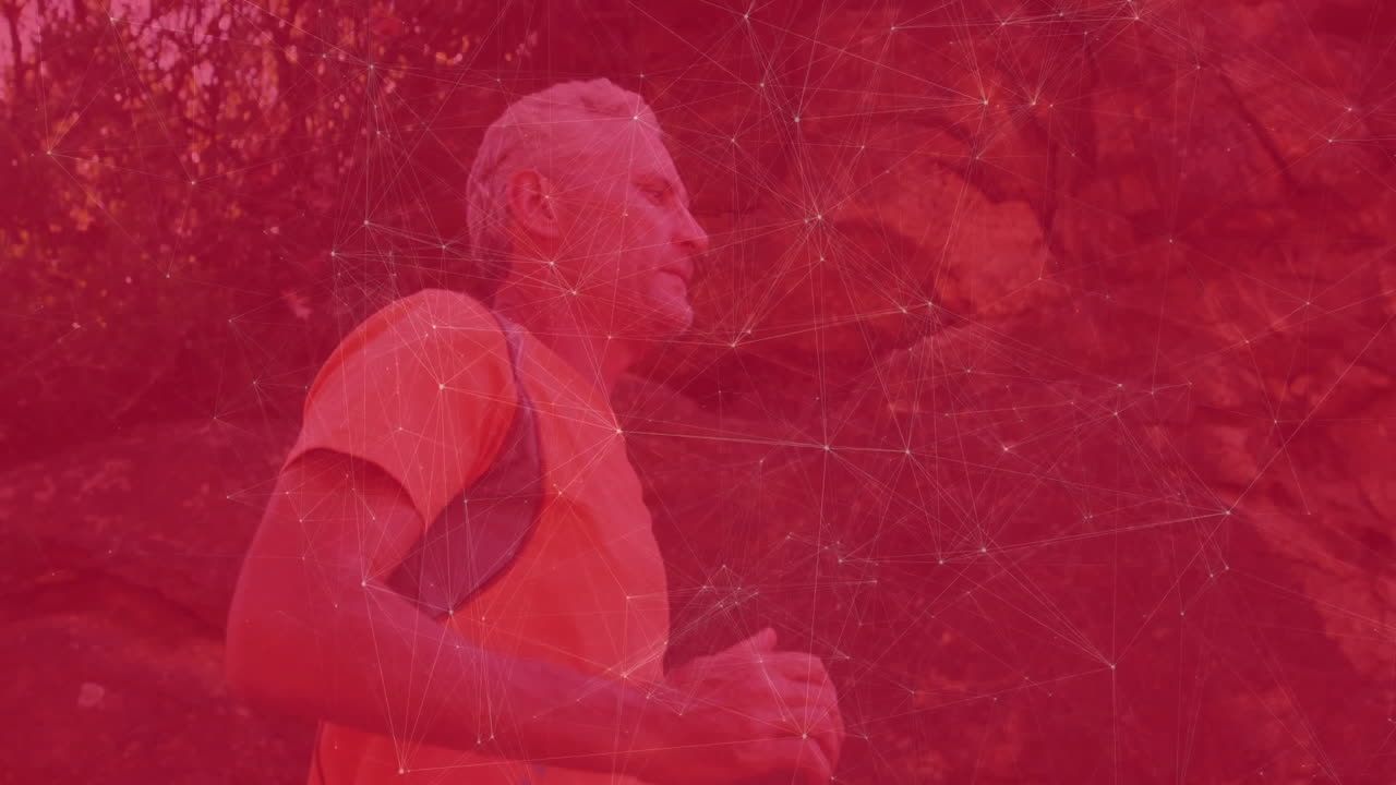 Hiking on trail, man with digital network overlay on red background