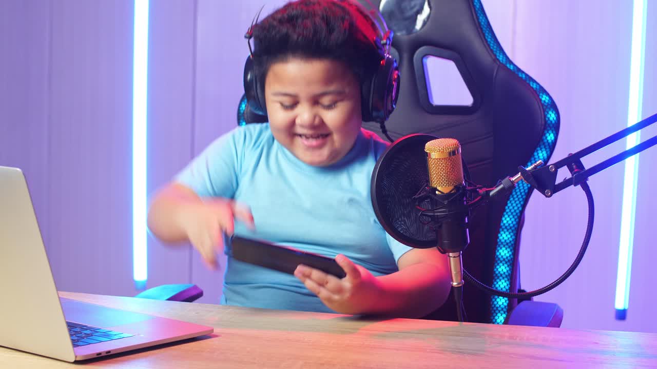 Asian Little Boy Playing Video Game With Mobile Phone Then Celebrating While Live Stream
