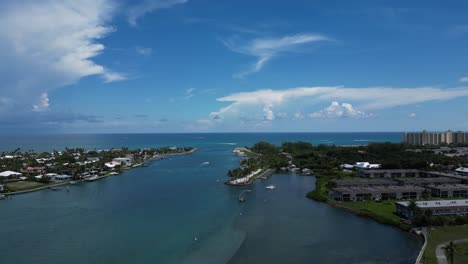 aerial drone footage over the loxahatchee river leading out to the atlantic ocean in florida