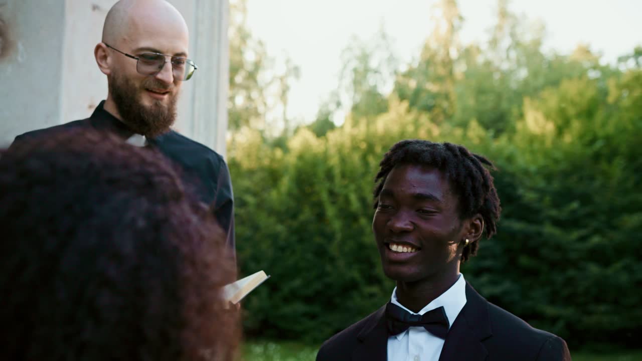 Wedding ceremony with groom and priest