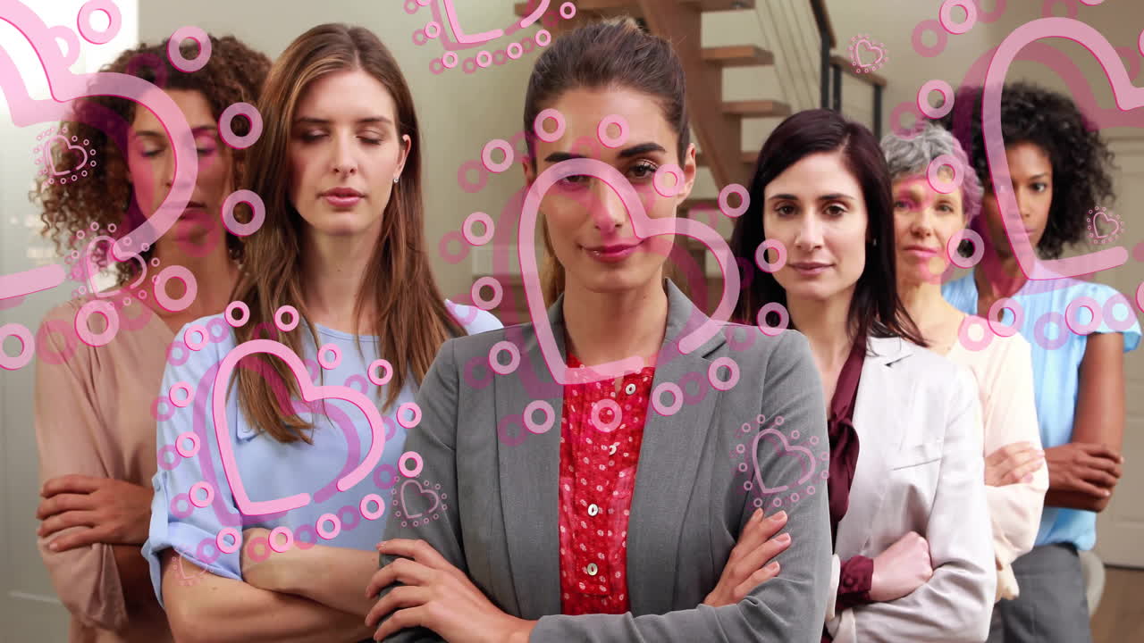 Animation of hearts over diverse women crossing arms