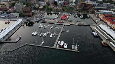 Constitution-Dock,-scence-of-the-Sydney-to-Hobart-yacht-race-conclustion-from-the-air-on-a-beautiful-afternoon,-Hobart-waterfront