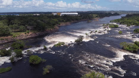 the camera pans out to showcase the vastness of the caroní river and the surrounding woodland