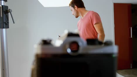 male photographer holding voice recorder 4k