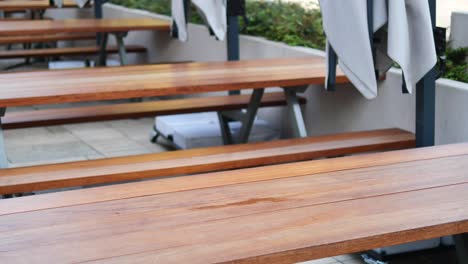 empty outdoor picnic tables at a restaurant