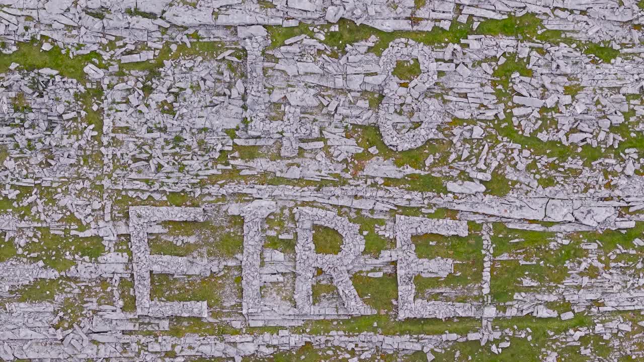 48 EIRE Sign Constructed With Rocks During World War II At Black Head in County Clare, Ireland. - aerial shot