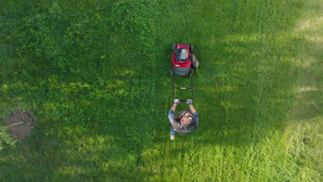 man mowing lawn with lawnmower