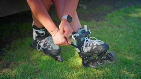 woman putting on roller skates outdoors
