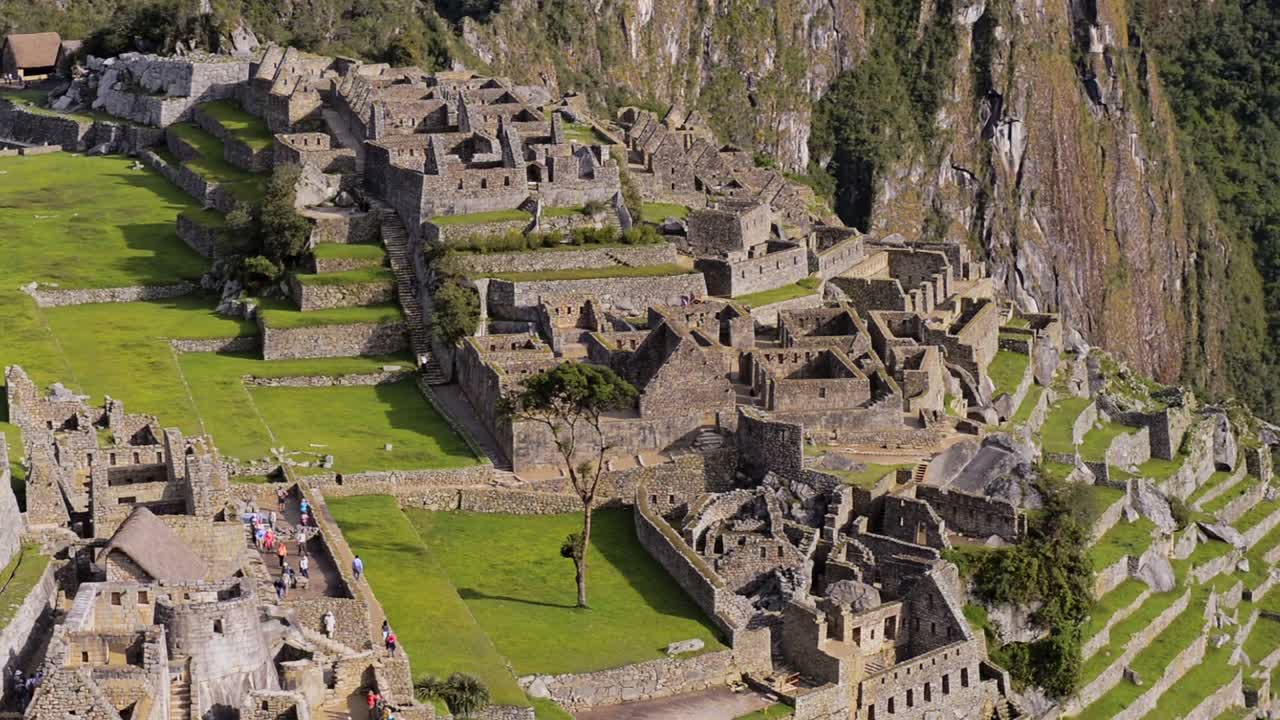 Machu Picchu ruins and terraces view from above, on a sunny day, Peru