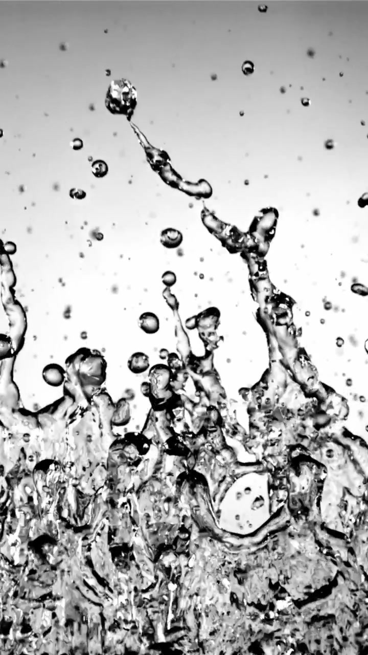 Dynamic Slow Motion Water Splashes and Falling Droplets on White