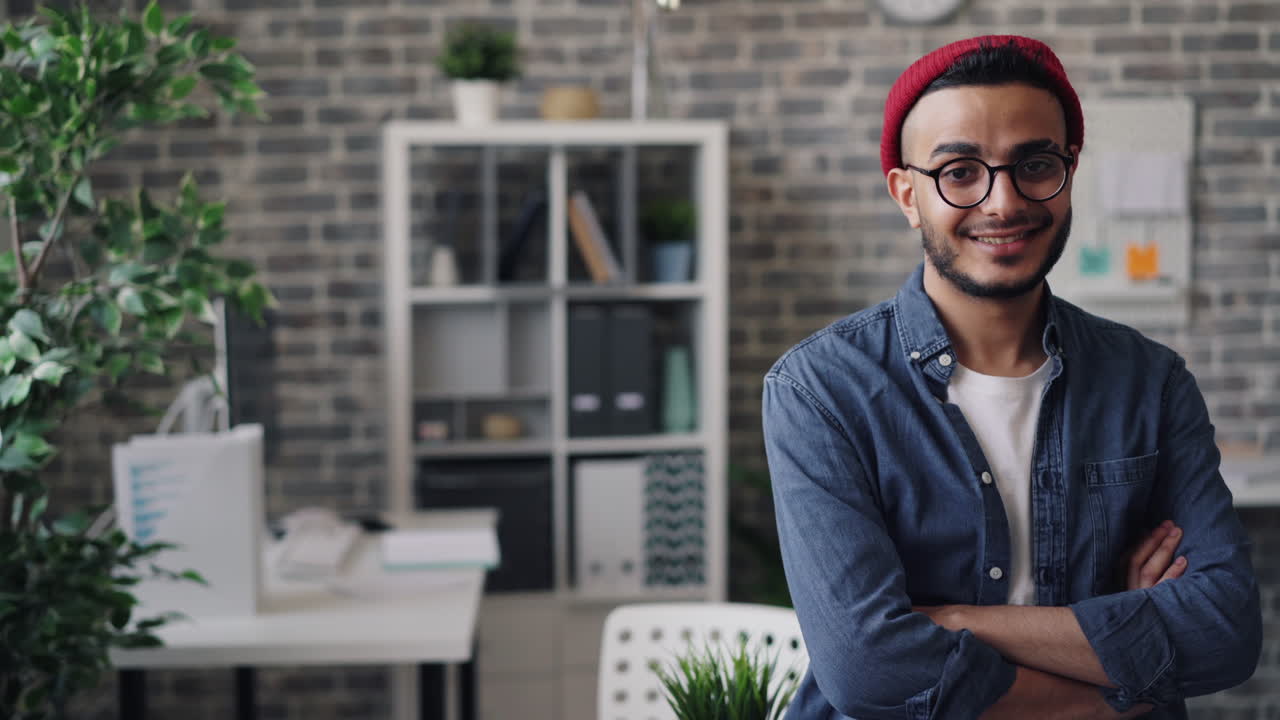 Smiling Young Man in Modern Office