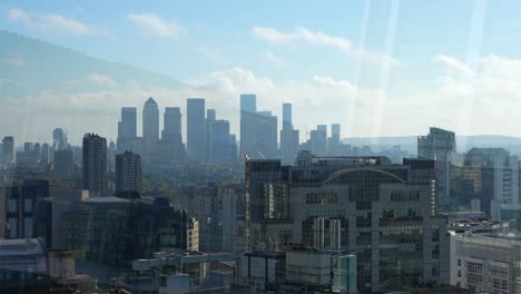 urban skyline with towering canary wharf skyscrapers in london, uk and modern architecture