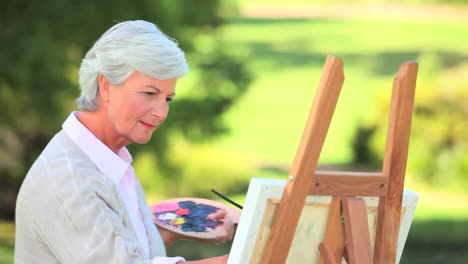 Mature-woman-painting-