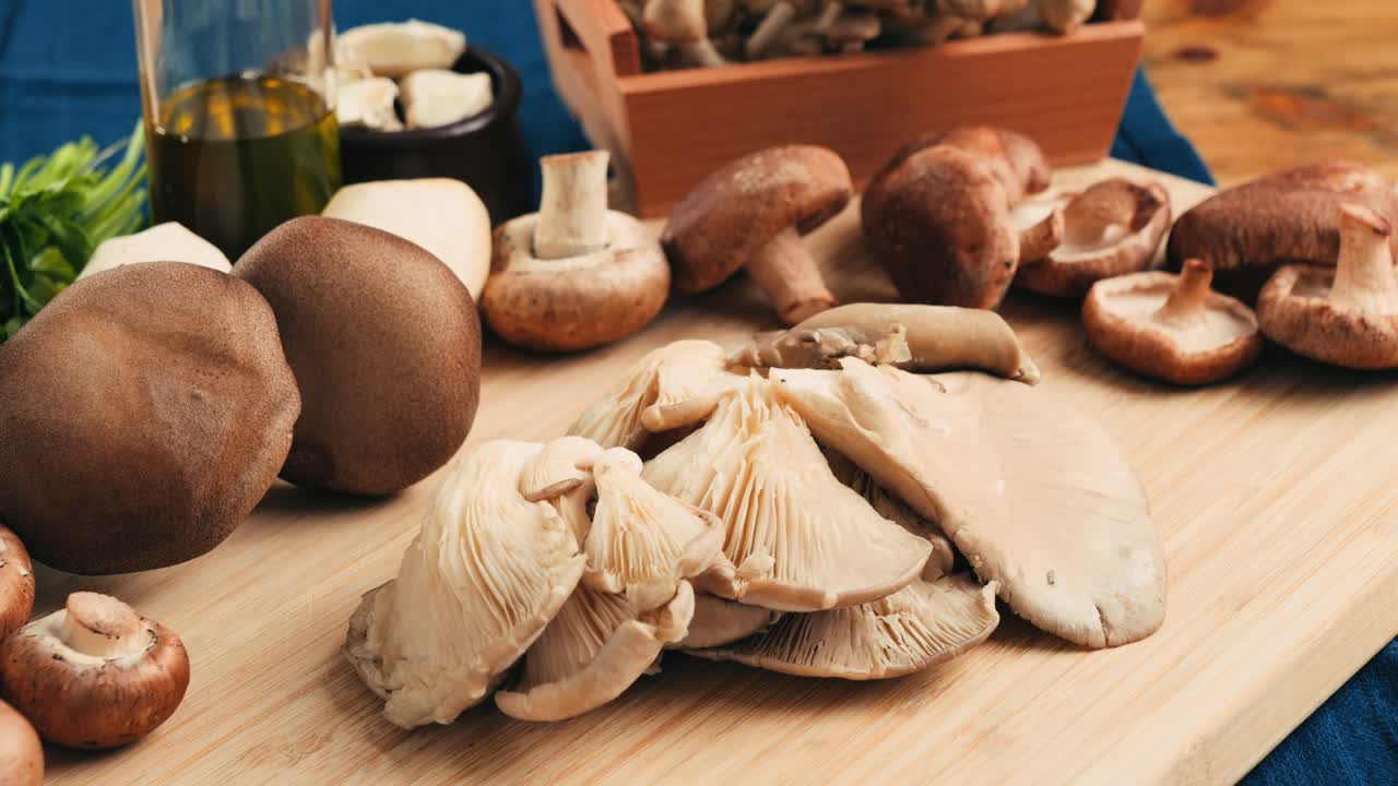 Assorted Fresh Mushrooms on Wooden Board