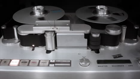 Recording-studio-tape-machine-with-spinning-reels-of-analog-tape