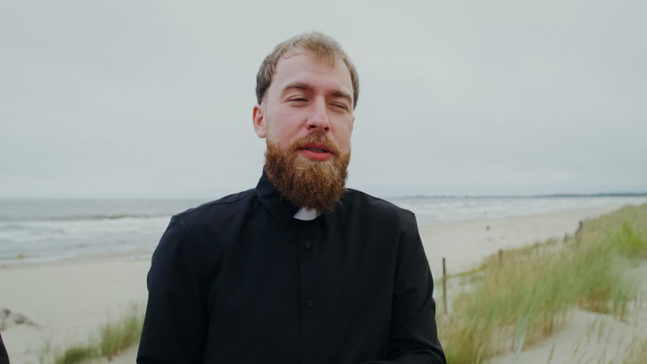 Priest on the beach