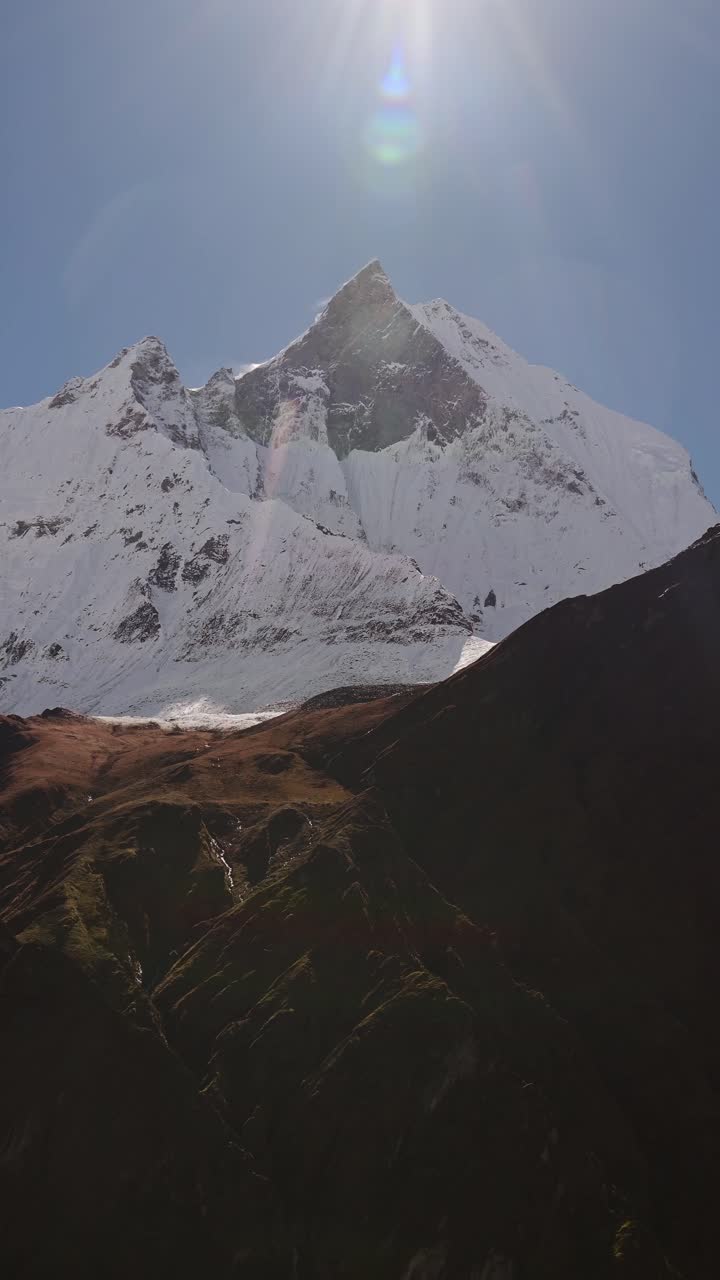Mountain Summit on Sunny Day Background with Copy Space for Text, Sun Shining and Snowcapped Mountains Vertical Video for Social Media Instagram Reels and Tiktok, Snowy Mountain Peak with Sunshine