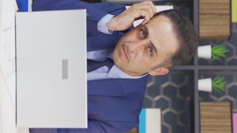 Vertical-video-of-Thoughtful-businessman.