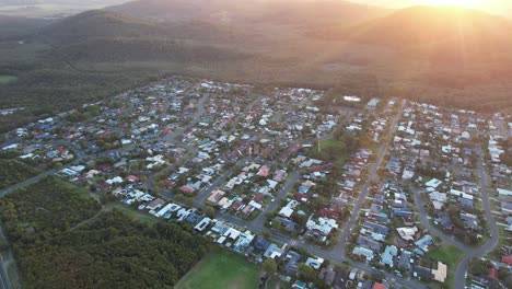 suburb cabarita at sunset in new south wales, australia - aerial drone shot