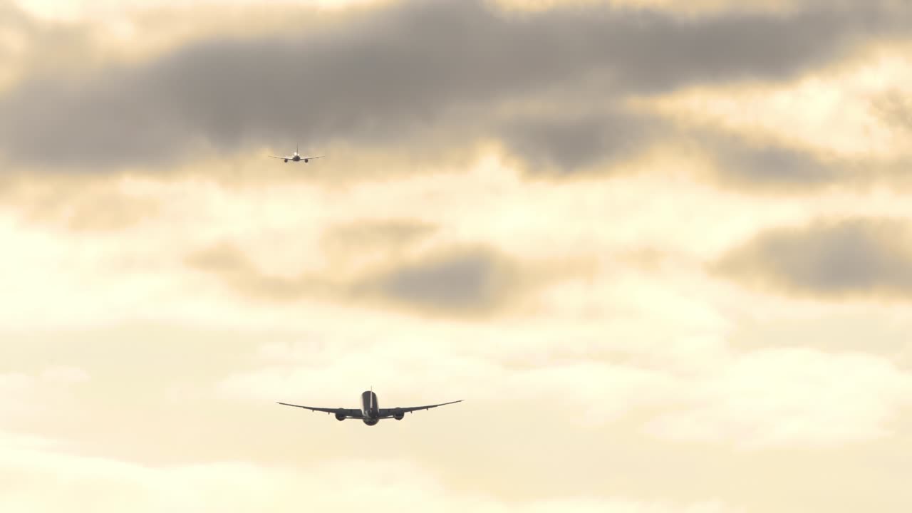 Two planes departure in the evening sky