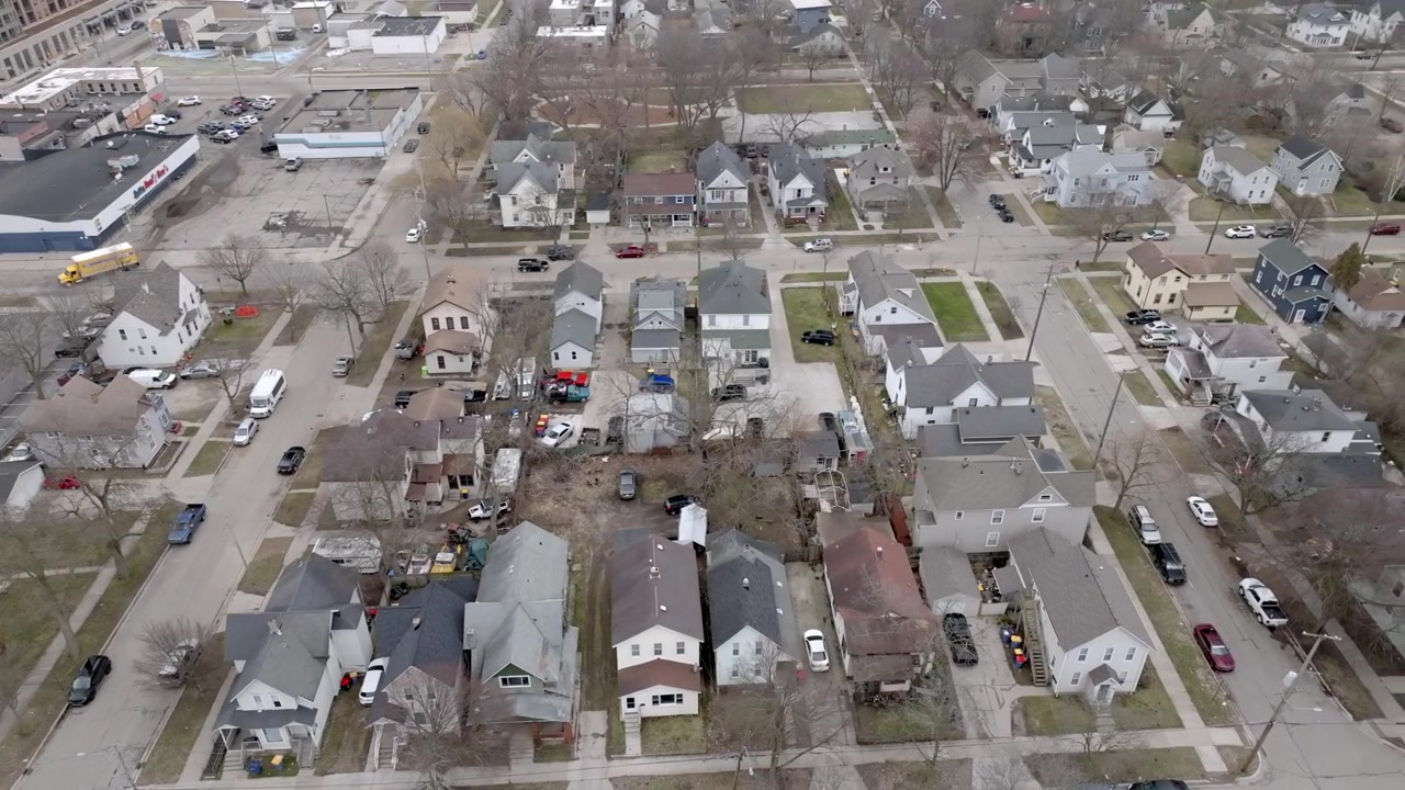 Neighborhood in Grand Rapids, Michigan with drone video moving left to right.