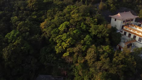 Sideways-Drone-Reveal-of-a-Golden-Temple-in-Hong-Kong