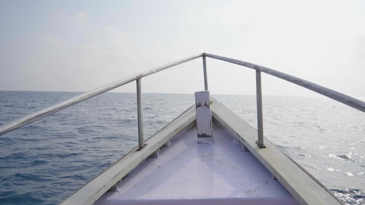 Looking out over the starboard of an andaman fishing boat as it points out to the andaman sea in the afternoon sun
