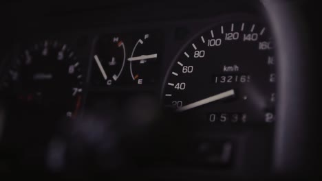 JDM-car-speedometer-closeup-with-moving-light-in-the-dark