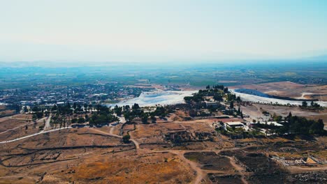 Aerial-4K-drone-video-of-a-tourist-attraction-Pamukkale,-natural-pool-with-blue-water,-Turkey-Calcareous-minerals