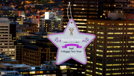 star shaped happy christmas and new year text banner against aerial view of night cityscape