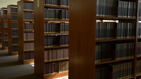 rows of organized bookshelves in a library