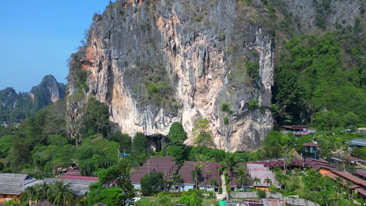 view of Railay Beach and Phra Nang Beach from a mountain viewpoint in Krabi, Thailand. Amazing aerial view flight ascending drone
