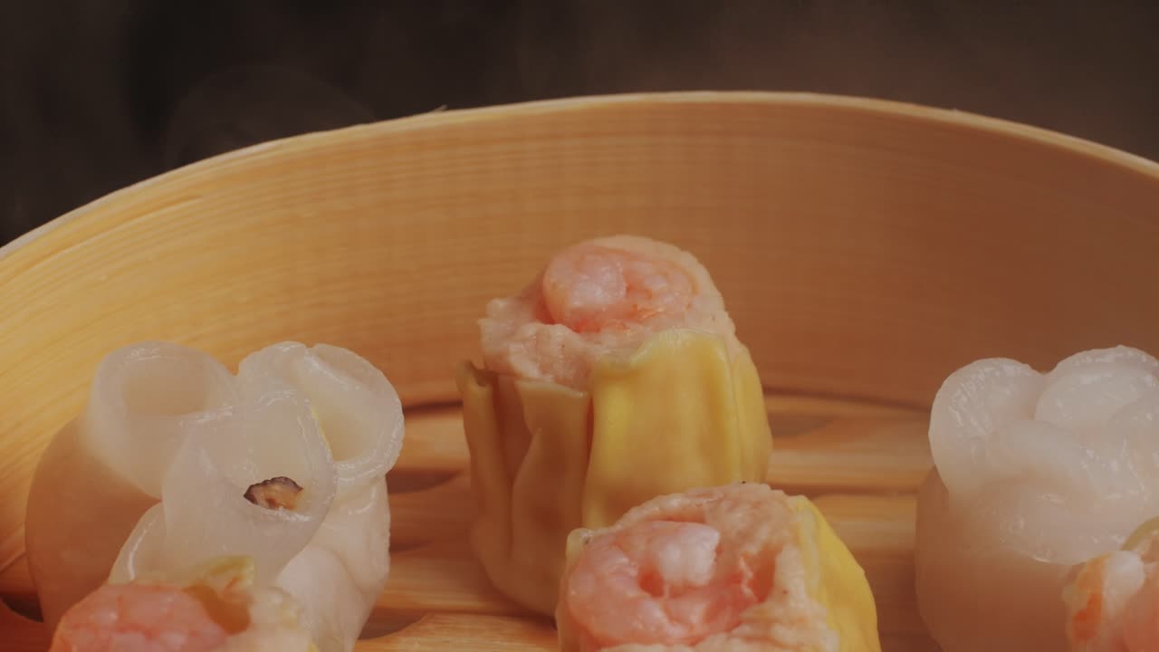 Various of dim sum on wooden steamer close-up macro. Steaming Technique. Chinese dessert food. Dimsum with shrimps, fish and meat. Dish in a cafe. Homade. Delivery