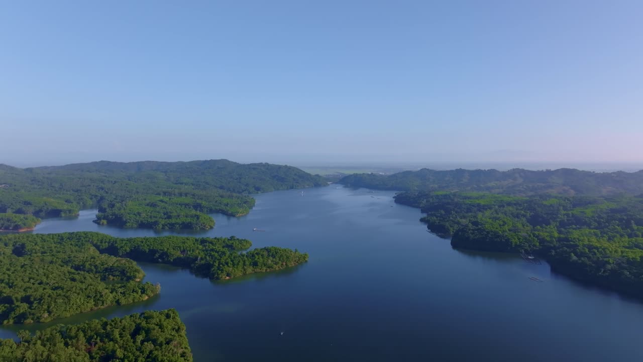 Reservoir of Rincon dam in Dominican Republic. Aerial forward, copy space
