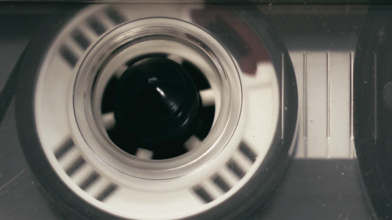 Close-up shot of Cassette player audio recording tape turning
