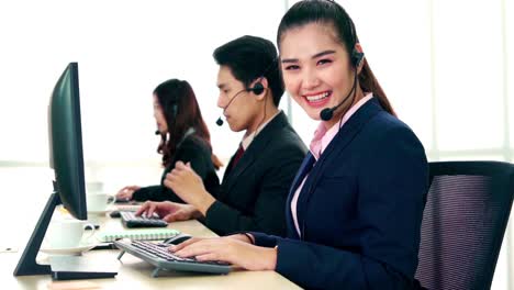 Business-people-wearing-headset-working-in-office