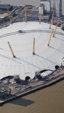 aerial view of the london docklands canary wharf skyline from a helicopter in vertical