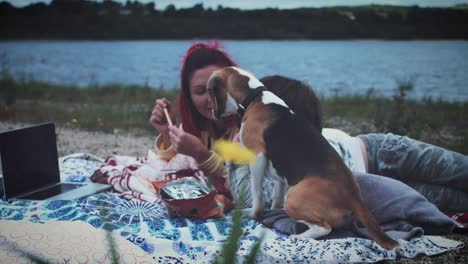 4k family having picnic next to the lake